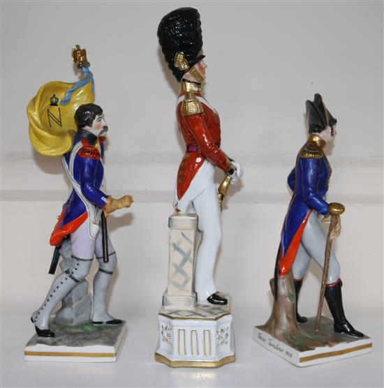 Two German porcelain models of Napoleonic soldiers and another of officer of the Grenadier Guards, 24cm - 31.5cm